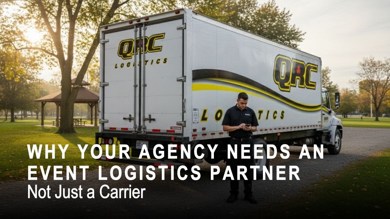 Event logistics partner coordinating time-critical delivery beside a QRC Logistics branded box truck at an outdoor event venue, ensuring on-time campaign materials handoff