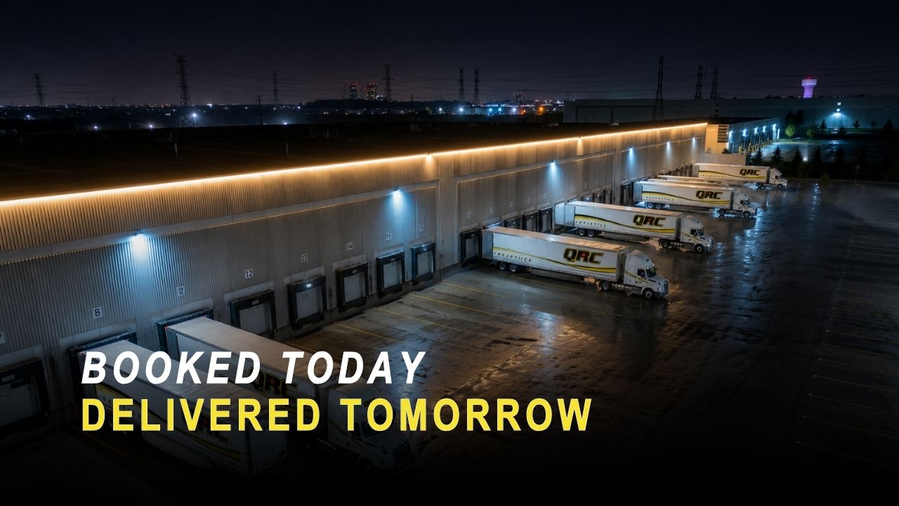QRC Logistics warehouse and loading dock in Halton Hills at night with trailers backed into the bays