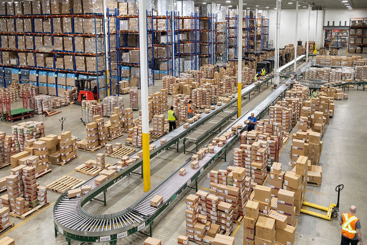 Workers picking and packing orders in an ecommerce fulfillment warehouse